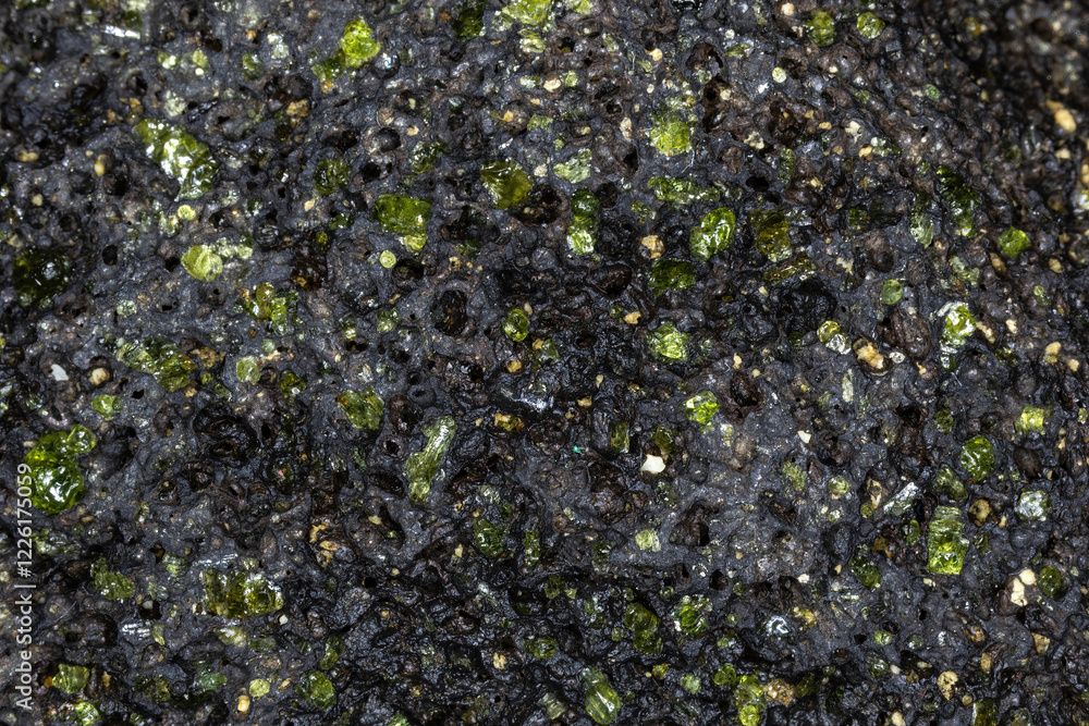 Closeup, raw peridot in volcanic rock matrix. From beach on the island of Hawaii, near South Point.
Closeup, raw peridot in volcanic rock matrix. From beach on the island of Hawaii, near South Point.