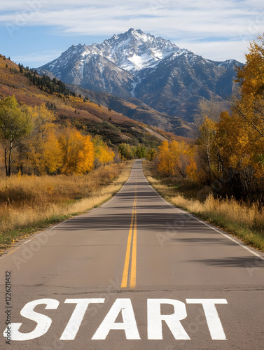 long road stretching into golden autumn landscape with mountains