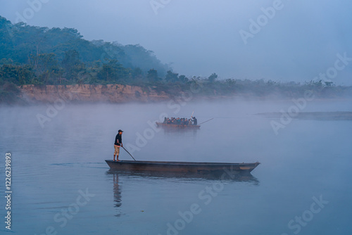 Tourist baoting on Rapti river in Sauraha, Chitwan, Nepal. photo