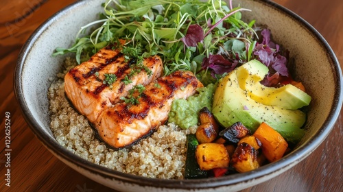 vibrant mediterraneaninspired wellness bowl with quinoa grilled salmon avocado roasted vegetables and microgreens in overhead composition photo