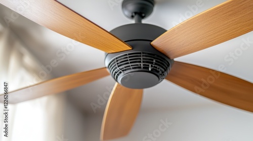 A modern ceiling fan with wooden blades, designed for home cooling and aesthetics.