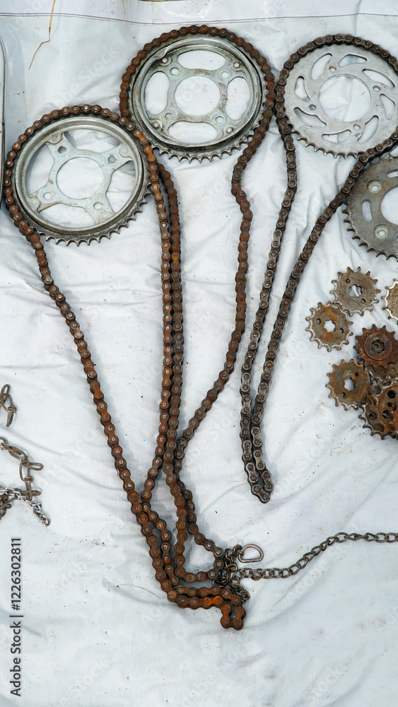 Used motorcycle chains and gears at a flea market Used motorcycle chains and gears at a flea market