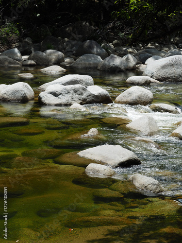 close up of mossman gorge flowing through rocks in port douglas  photo