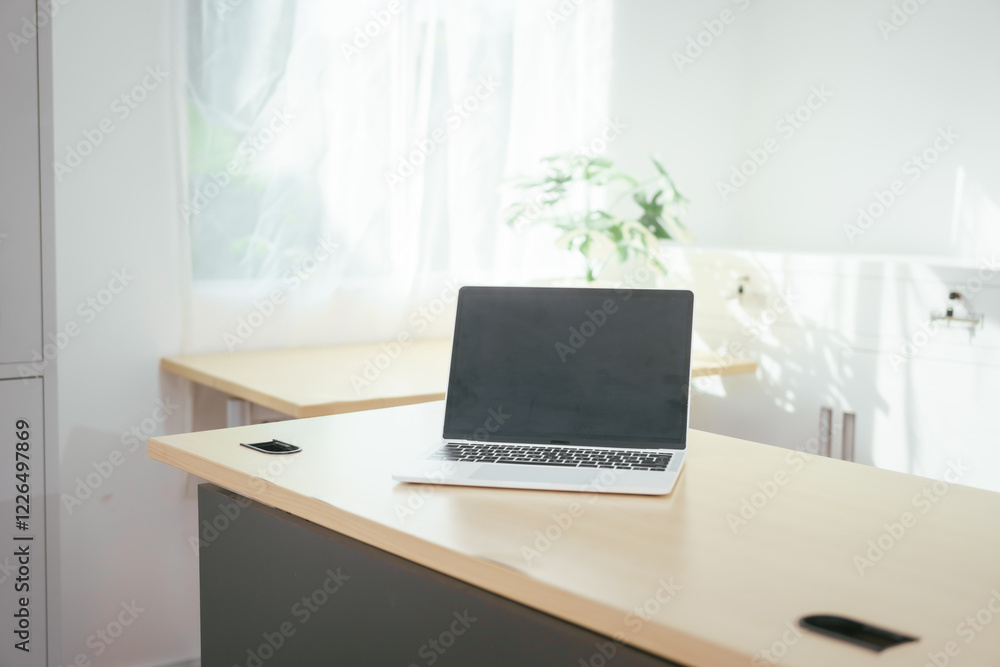 A computer is placed on the table, representing a modern workspace for digital tasks, online communication, research, creativity, or professional work in an organized and functional environment A computer is placed on the table, representing a modern workspace for digital tasks, online communication, research, creativity, or professional work in an organized and functional environment