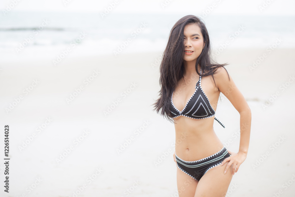 Beautiful young asian woman standing with happiness for relax on beach in tropical, happy woman in bikini with expression relaxation in holiday with seductive, recreation and leisure in summer. Beautiful young asian woman standing with happiness for relax on beach in tropical, happy woman in bikini with expression relaxation in holiday with seductive, recreation and leisure in summer.
