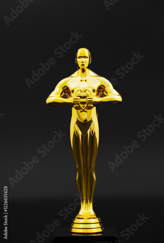 The golden statuette of the film award on a black background. awarding for achievements and successes. prestigious prize.