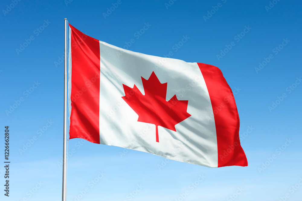 Waving canada flag, national symbol, blue sky Waving canada flag, national symbol, blue sky