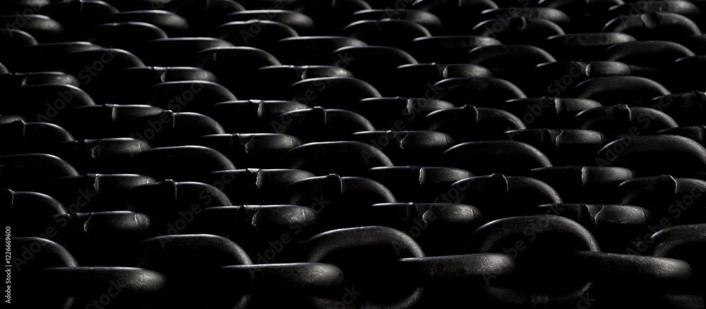 Fototapeta premium Heavy iron chain. Background of several chains laid out evenly.