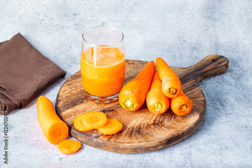 Carrot juice is a sweet, vibrant drink made from fresh carrots, packed with vitamins, antioxidants, and promoting eye health. photo