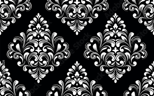 Wallpaper in the style of Baroque. Seamless vector background. White and black floral ornament. Graphic pattern for fabric, wallpaper, packaging. Ornate Damask flower ornament.