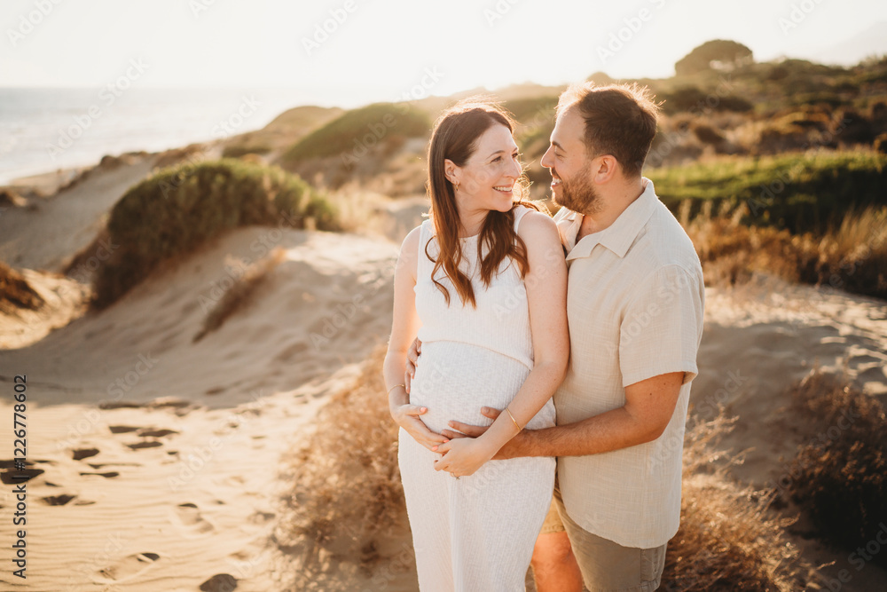 Happy Couple at beach Spain pregnant woman mom sunset Happy Couple at beach Spain pregnant woman mom sunset