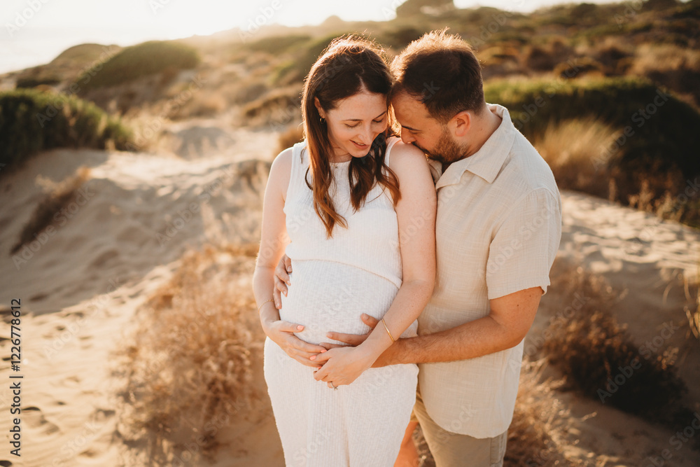 Happy Couple at beach Spain pregnant woman mom sunset Happy Couple at beach Spain pregnant woman mom sunset