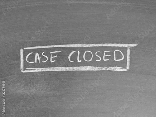 Case closed written on chalkboard background with white chalk photo