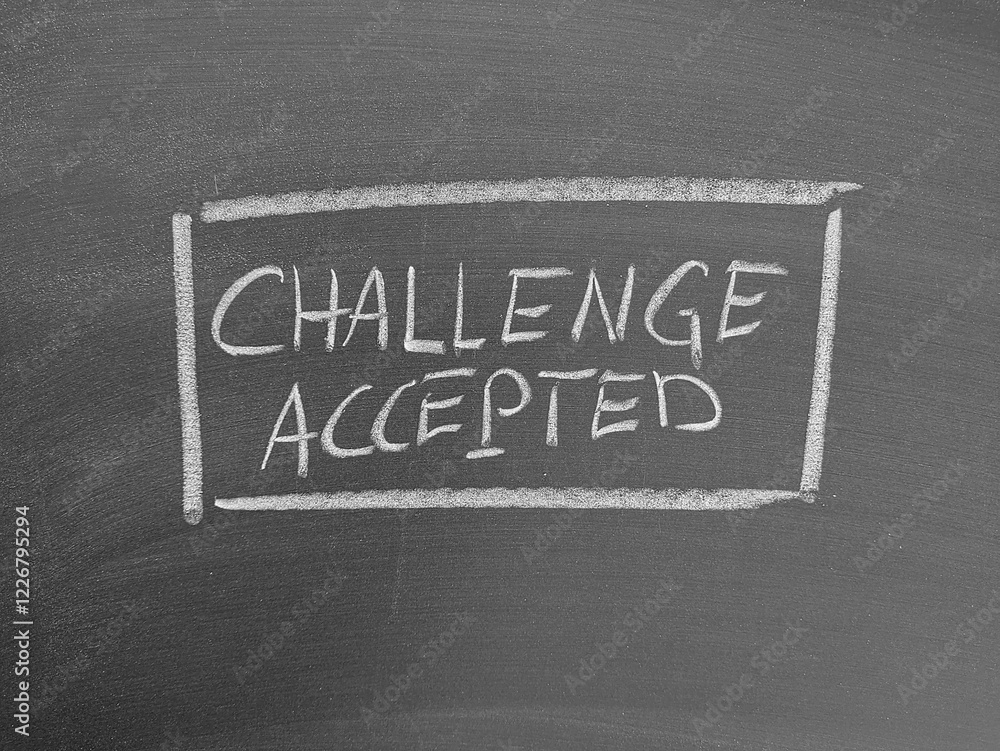 Obraz premium Challenge accepted text written with chalk on a blackboard surface