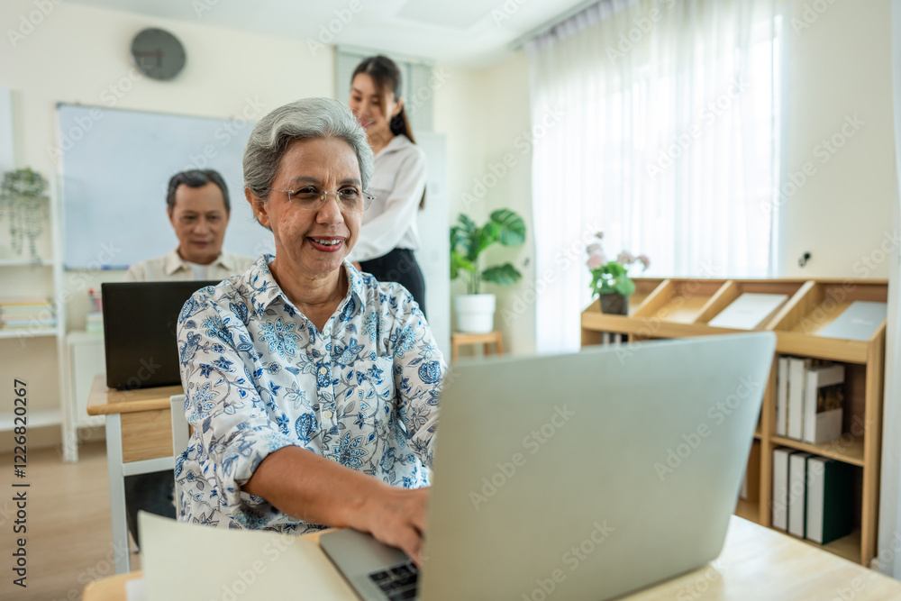 Obraz premium Group of Asian mature students study with instructor in class at school. 