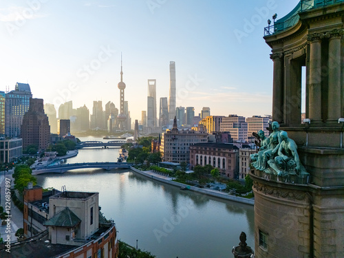 Photography Aerial View of Shanghai skyline at sunrise with the Winding River