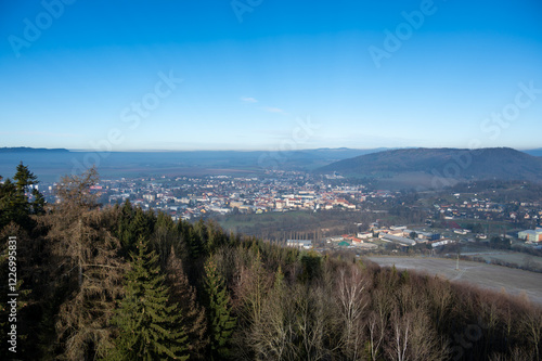 Obraz na płótnie Aerial view of Moravska Trebova with its scenic panorama. The town is surrounded by rolling hills and dense forests, showcasing the harmony of historic architecture and Czech nature w salonie