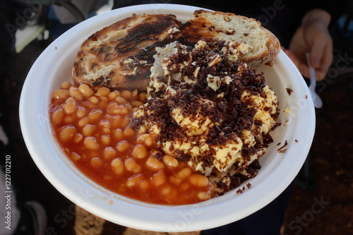 Paper plate, delicious, easy to make, quick to prepare, camping food. Baked beans, scrambled eggs with shredded biltong, beef jerky and toast photo