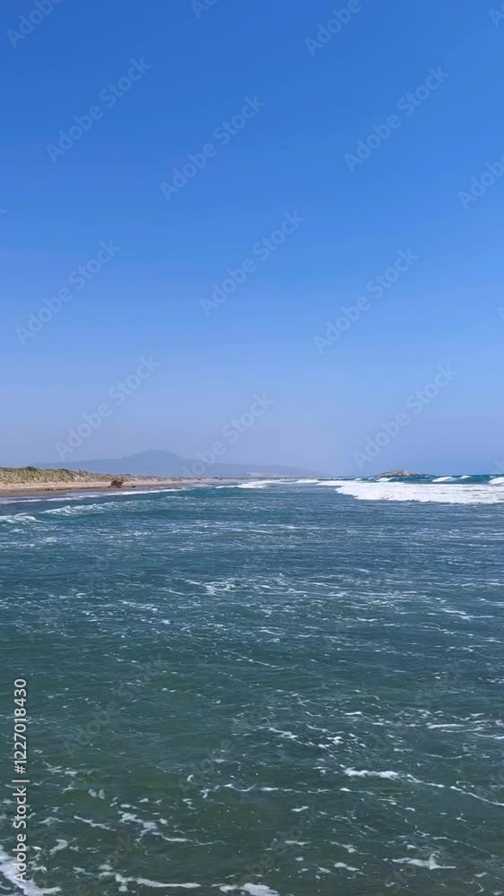 Patara Beach in Turkey is the longest sandy beach in Turkey. Beautiful, very fine sand and turquoise sea. Waves breaking on the sand. The beach with turtles. White foam. The Mediterranean Sea. 4K Patara Beach in Turkey is the longest sandy beach in Turkey. Beautiful, very fine sand and turquoise sea. Waves breaking on the sand. The beach with turtles. White foam. The Mediterranean Sea. 4K