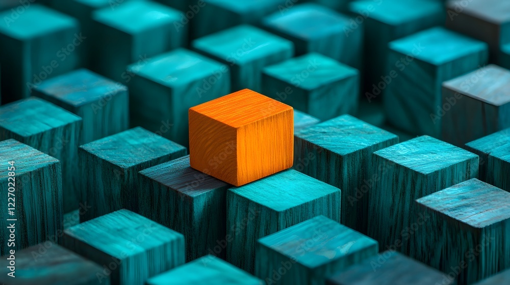 Obraz premium orange wooden block standing out among teal cubes