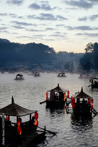 Boat trip on the lake in the morning at Ban Rak thai village in Mae Hong Son, Thailand photo