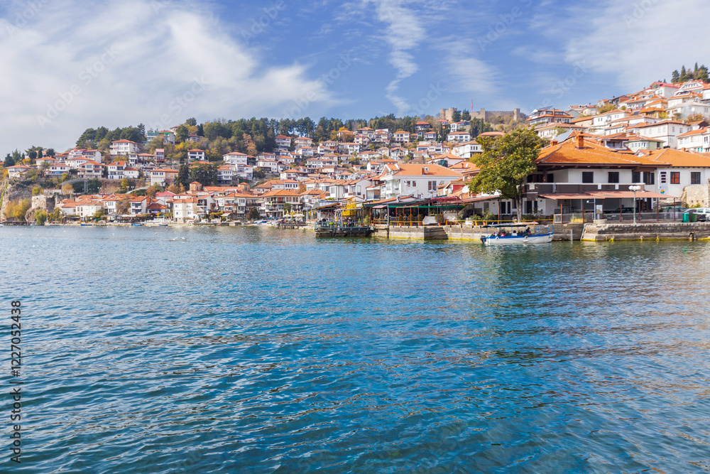 Fototapeta premium Picturesque view of Ohrid, North Macedonia, a historic town on Lake Ohrid shore, known for its charming architecture and stunning lake views, making it a popular tourist destination.