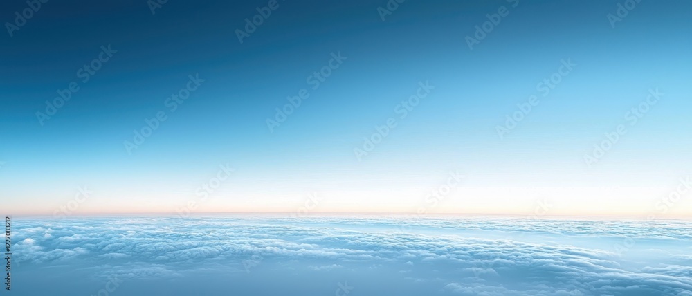 Obraz premium Vast blue sky with soft clouds at dawn or dusk.