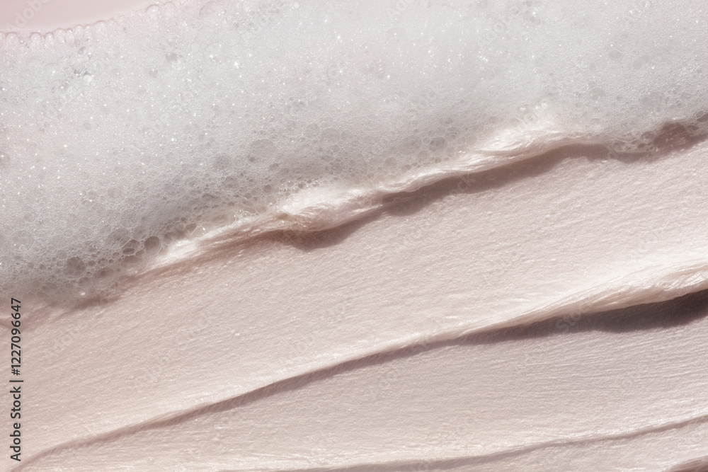 Obraz premium Cosmetic smudge swatch face cleanser smudge brush stroke and soapy bubble foam on beige background