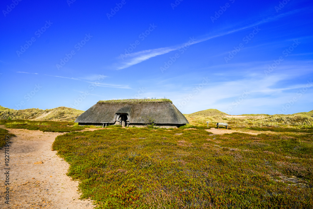 Landscape with a view of an Iron Age house on the North Frisian island of Amrum.
Landscape with a view of an Iron Age house on the North Frisian island of Amrum.