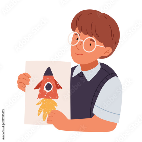 A child boy holds a drawing of a space rocket in his hands.