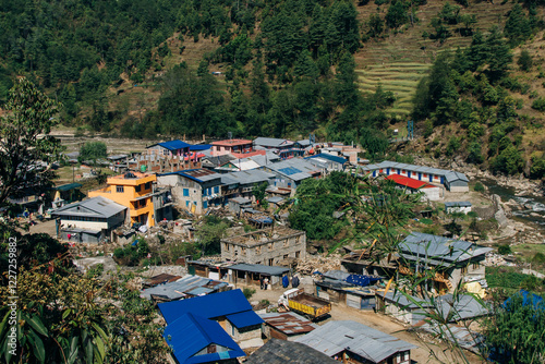 Terraced farming in Nepal. Village on a terraced hill during Annapurna Circuit Trek in Himalayas, Annapurna Conservation Area, Nepal. Rise fields. Agricultural concept photo