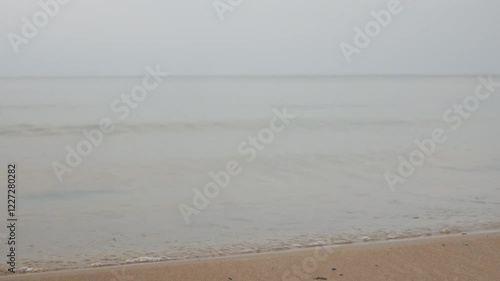 Gentle waves washing ashore on a serene baltic sea beach