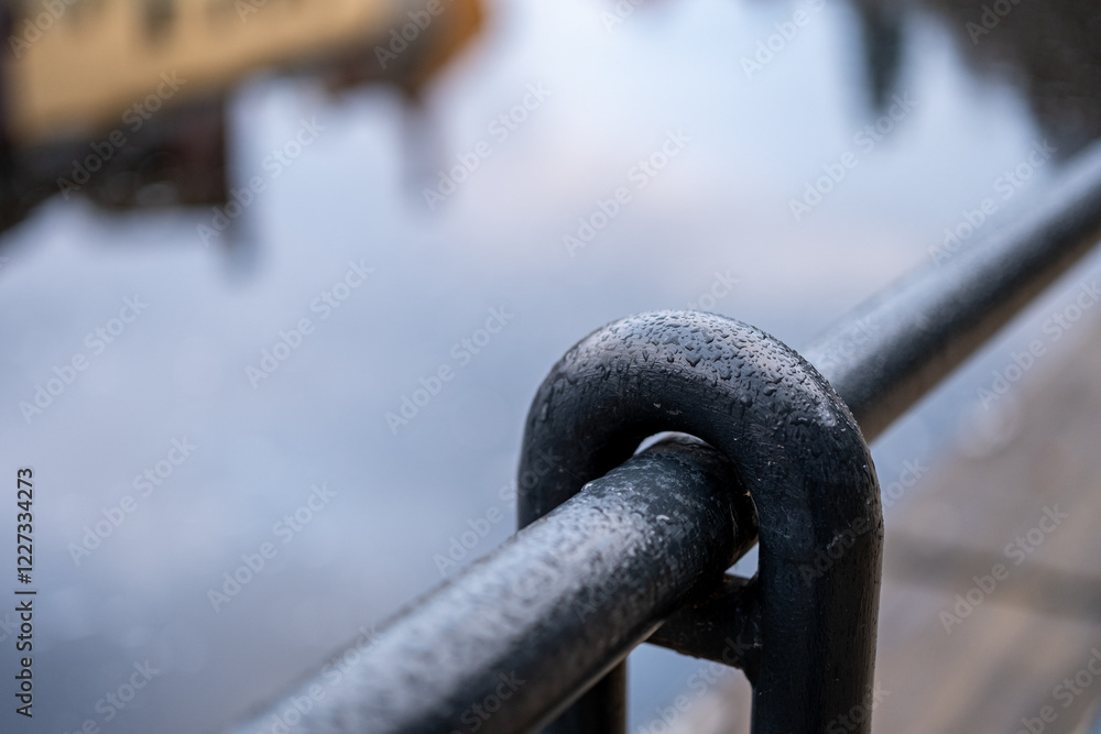 Naklejka premium Railing Close-Up with River Reflection