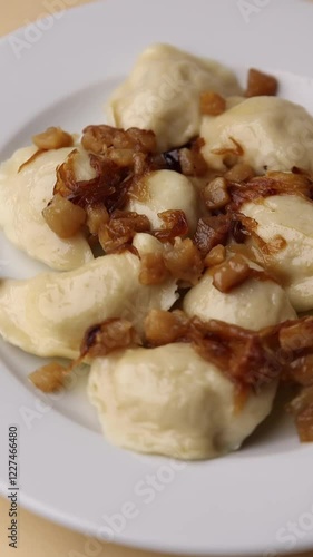 Ukrainian dumplings. On a white plate. Close-up.