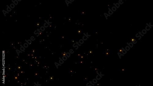Fire sparks flying with the wind blowing from left to right.