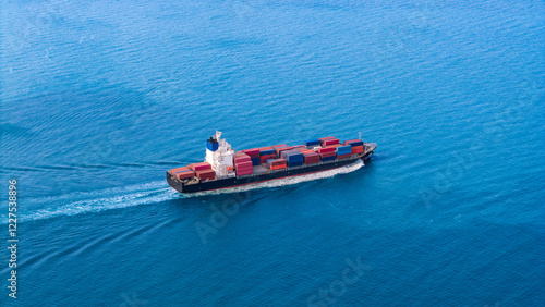 Top view Cargo Container ship with contrail in the ocean ship carrying container and running for import export concept technology freight shipping by ship.