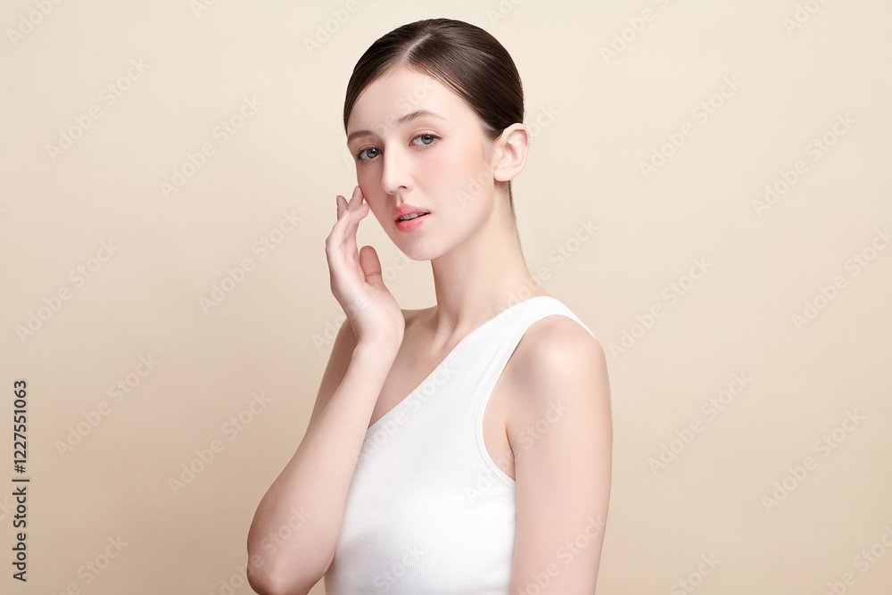 Beautiful young woman with clean fresh skin on beige background, Face care, Facial treatment, Cosmetology, beauty and spa, women portrait. Beautiful young woman with clean fresh skin on beige background, Face care, Facial treatment, Cosmetology, beauty and spa, women portrait.