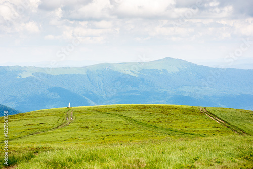 alpine meadow of mountain smooth in summer. spectacular highland wallpaper. cloudy weather. watershed ridge of ukrainian carpathians in the distance. landscape with wide open vista photo