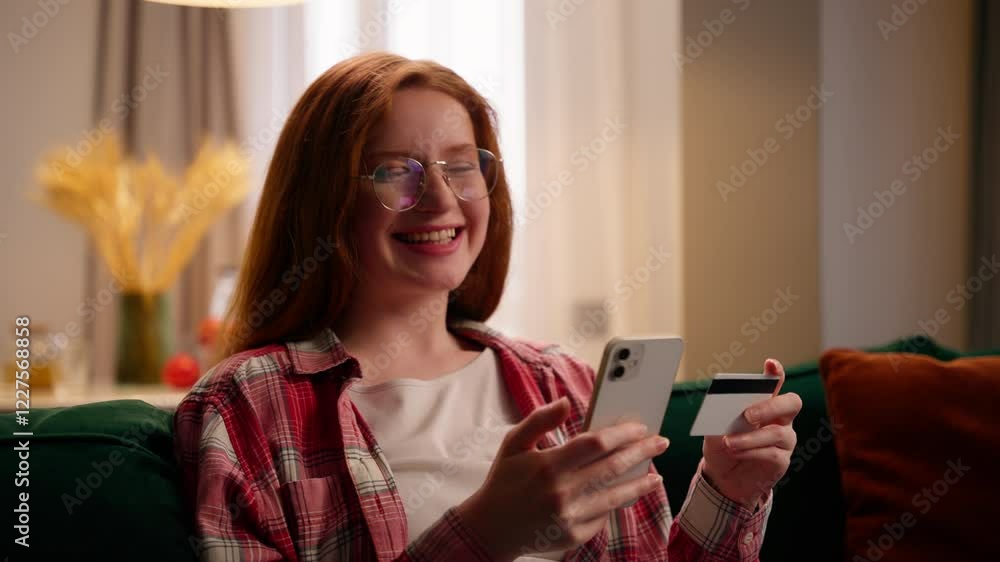 Smiling Caucasian woman girl female holding credit card mobile phone shopping satisfied at home making purchase application using marketplace websites bank online enjoy easy transfer money modern app Smiling Caucasian woman girl female holding credit card mobile phone shopping satisfied at home making purchase application using marketplace websites bank online enjoy easy transfer money modern app