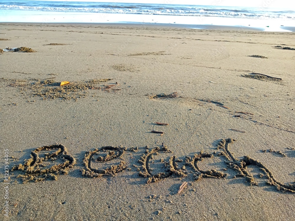 Obraz premium word beach written on the sand