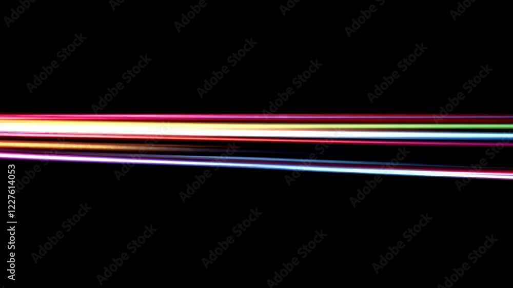 Horizontal streaks of vibrant light in red, orange, yellow, blue, and purple hues move across a black background. Abstract light painting effect Horizontal streaks of vibrant light in red, orange, yellow, blue, and purple hues move across a black background. Abstract light painting effect