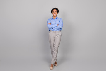 Full body photo of attractive young businesswoman crossed hands confident dressed stylish formalwear isolated on gray color background