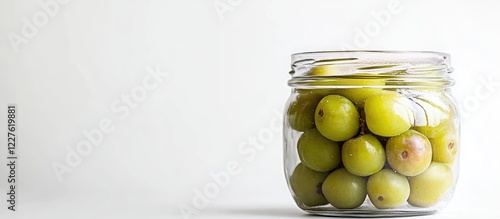 Greengage Plums in Transparent Jar on White Background with Room for Text Ideal for Food and Culinary Illustrations photo