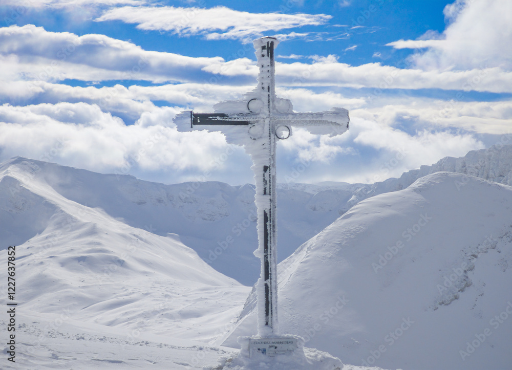Campo Felice, Italy - The suggestive plateau peak in Abruzzo region, Monte Puzzillo and Morretano summit mount range, during the winter with snow and alpinists in altitude