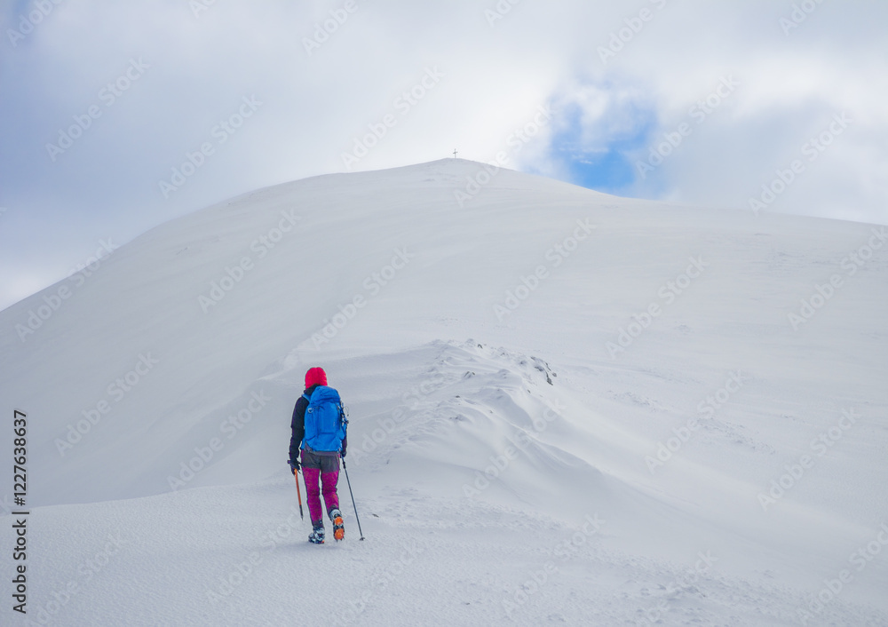 Campo Felice, Italy - The suggestive plateau peak in Abruzzo region, Monte Puzzillo and Morretano summit mount range, during the winter with snow and alpinists in altitude