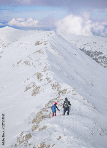 Campo Felice, Italy - The suggestive plateau peak in Abruzzo region, Monte Puzzillo and Morretano summit mount range, during the winter with snow and alpinists in altitude