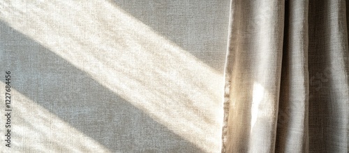 Warm sunlight streaming through curtains in a cozy living room with a serene atmosphere and ample empty space for text or design elements