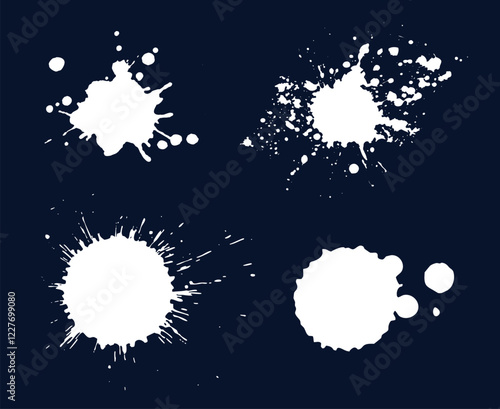 Set of abstract white ink splatters and paint drops on a dark background, ideal for grunge, artistic, and creative designs