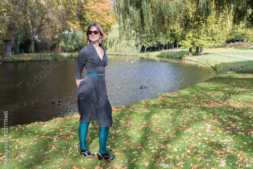 Outdoor portrait of a 31 yo woman in the Stuyvenberg Royal city park, Laeken , Brussels, Belgium photo