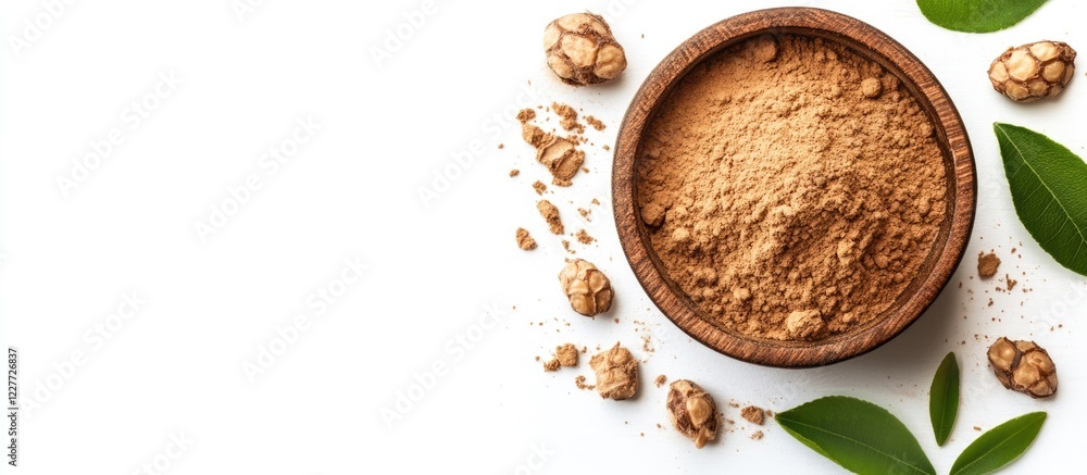 Sacha Inchi Powder in Wooden Bowl on White Background with Fresh Green Leaves and Space for Text or Product Description Sacha Inchi Powder in Wooden Bowl on White Background with Fresh Green Leaves and Space for Text or Product Description